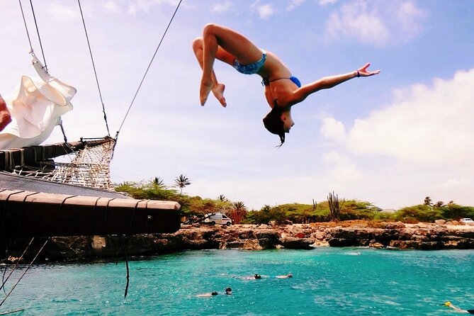 Set Sail in Aruba: Jolly Pirate Cruise with Snorkel Adventure - The rope swing gives the cruise its comic finish