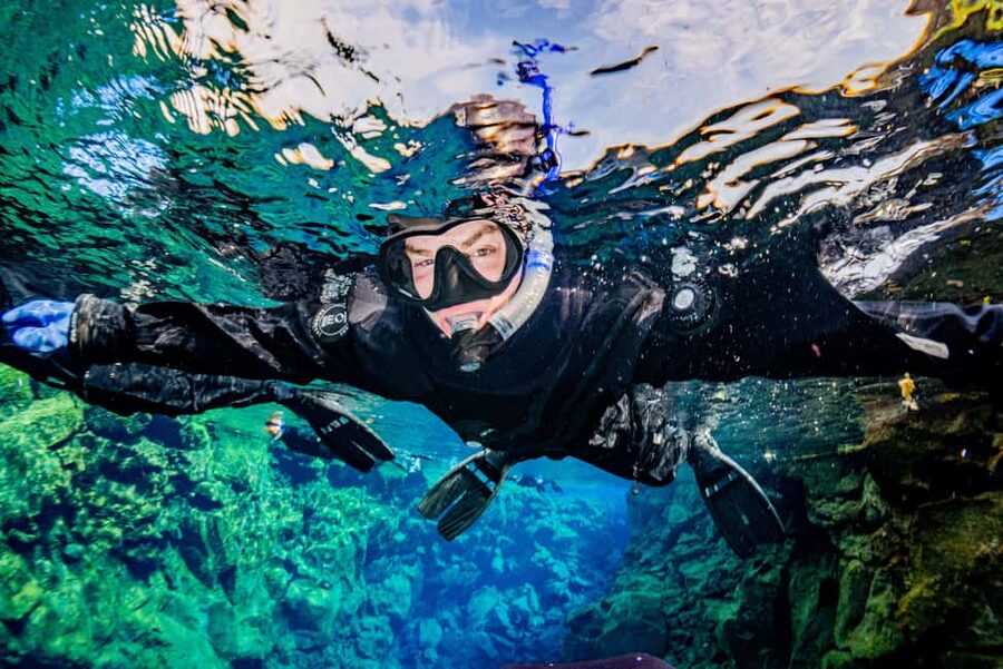 Silfra: Snorkel Between Continents. Free Professional Photos - One group of six changes the mood