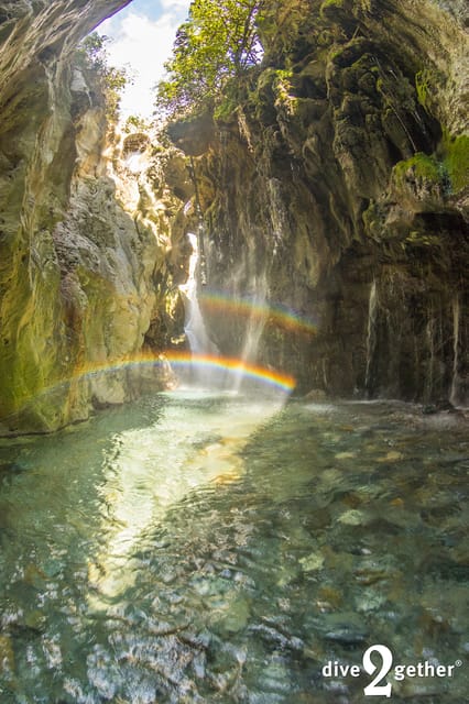 Snorkel trip to the Kourtaliotiko Waterfalls Plakias - Walking through hip-deep spring water