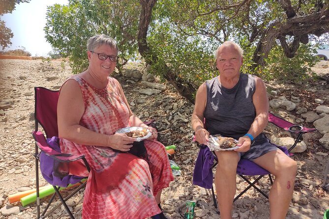 Snorkeling and Grilling Fresh Fish at Donkey Beach - Cleaning and grilling the catch