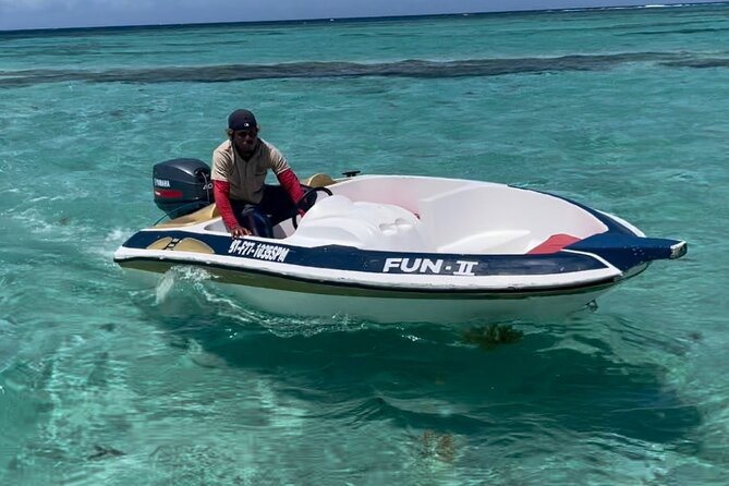 Speed Boat and Snorkeling in Punta Cana Bavaro - Taking the wheel on a small boat