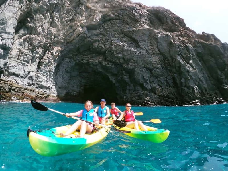 Tenerife: Kayak & Snorkel with Local Fauna, Photos Included - Entering a small sea cave near the cliffs