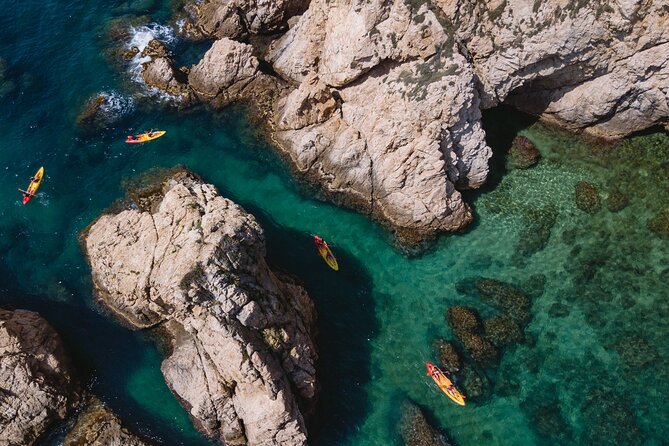 Tossa de Mar: Kayak & Snorkel Tour with Paella from Barcelona - Kayaking along coves, cliffs, and caves